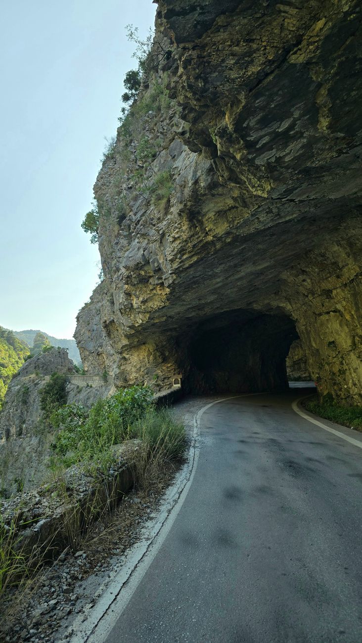 scenic tunnel road through rocky mountain pass